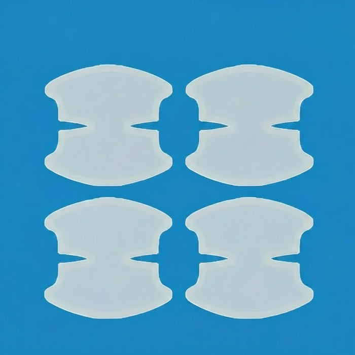 Quatro protetores de silicone para joanete sobre fundo azul, acessórios ortopédicos